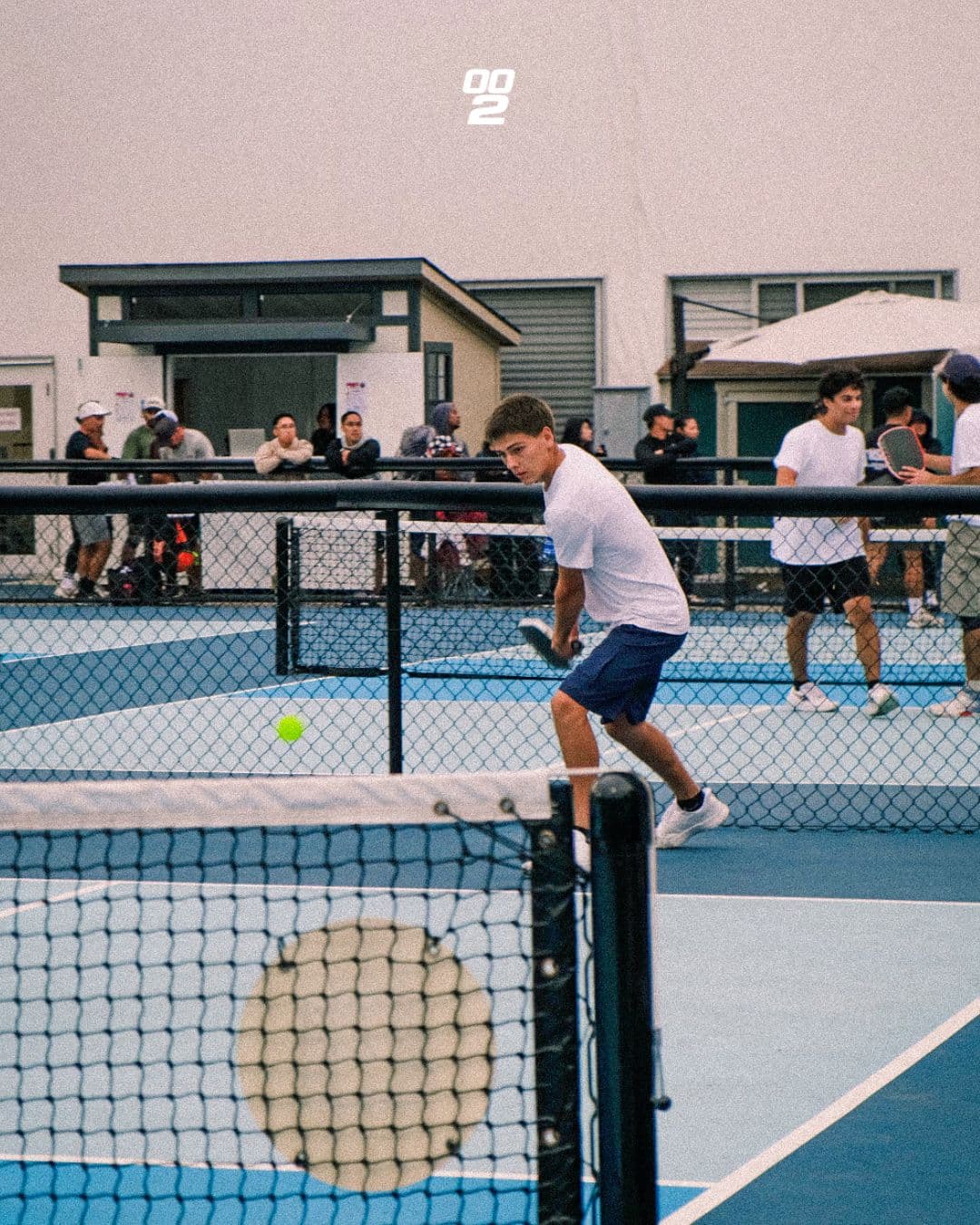 Player at the kitchen line during a First Serve match